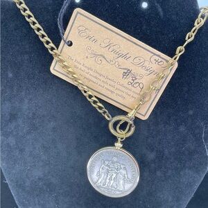 Erin Knight Designs necklace, a gold watch chain with a Lady Liberty coin